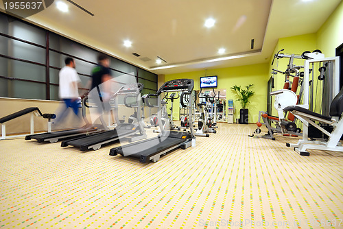 Image of Man running on treadmill in gym