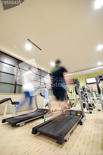 Image of Man running on treadmill in gym