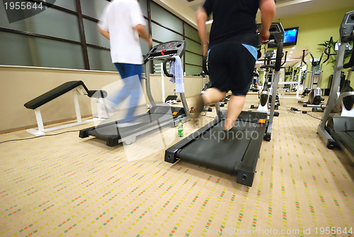 Image of Man running on treadmill in gym