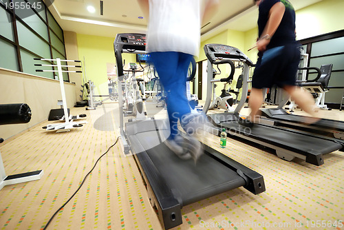 Image of Man running on treadmill in gym