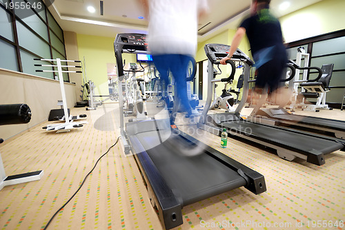 Image of Man running on treadmill in gym