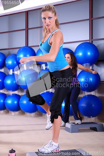 Image of woman stepping in a fitness center