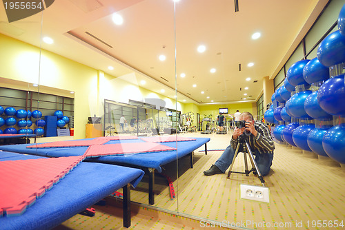 Image of photographer in fitness club