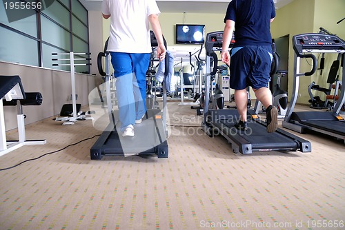 Image of Man running on treadmill in gym