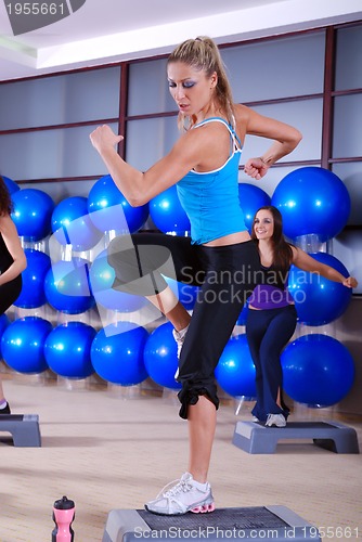 Image of woman stepping in a fitness center