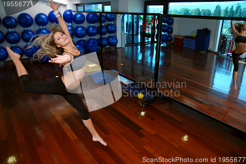 Image of girl jumping in fitness studio