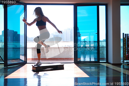 Image of women stepping in a fitness center 