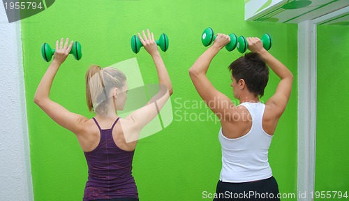 Image of fitness training with dumbbell 