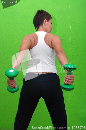 Image of fitness training with dumbbell 