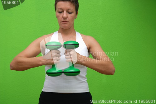 Image of fitness training with dumbbell 