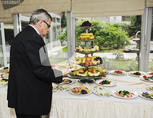 Image of people catering food