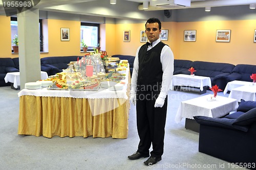 Image of Young waiter in reataurant