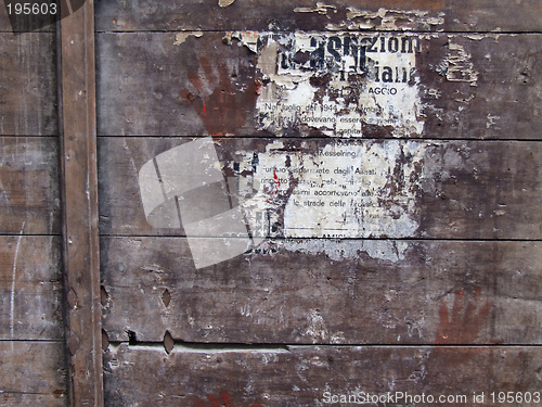 Image of Poster remains on wooden surface