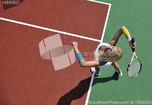 Image of young woman play tennis game outdoor