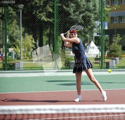 Image of young woman play tennis game outdoor