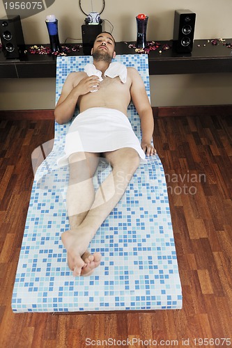 Image of man relaxing at spa