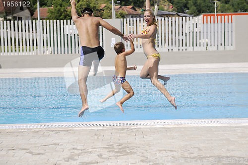 Image of happy young family have fun on swimming pool