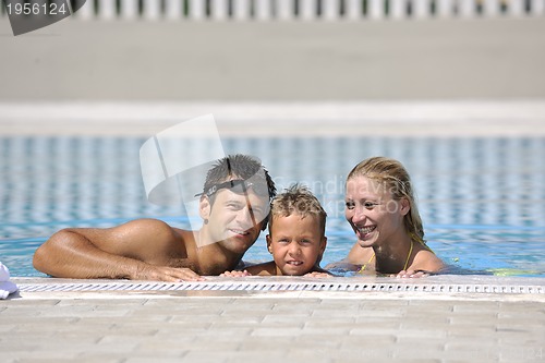 Image of happy young family have fun on swimming pool