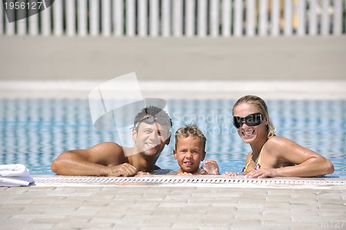 Image of happy young family have fun on swimming pool