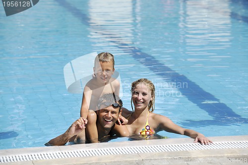 Image of happy young family have fun on swimming pool