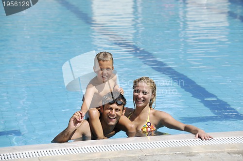 Image of happy young family have fun on swimming pool