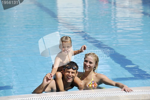 Image of happy young family have fun on swimming pool