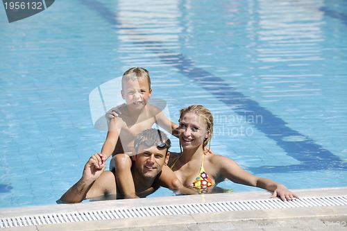 Image of happy young family have fun on swimming pool