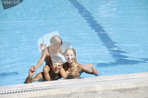 Image of happy young family have fun on swimming pool
