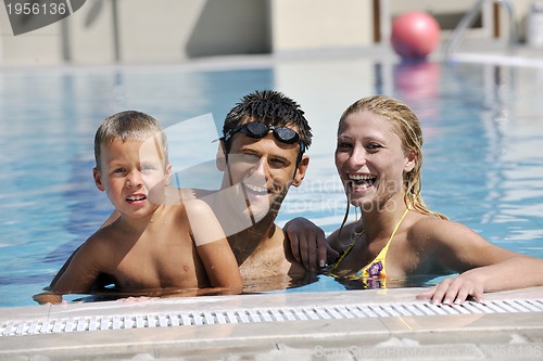 Image of happy young family have fun on swimming pool