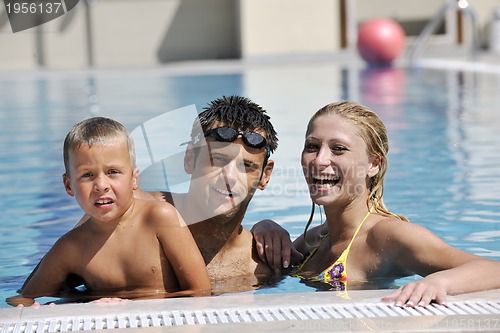 Image of happy young family have fun on swimming pool