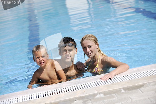 Image of happy young family have fun on swimming pool