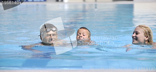 Image of happy young family have fun on swimming pool