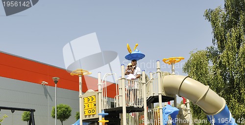 Image of family portrait at park playground