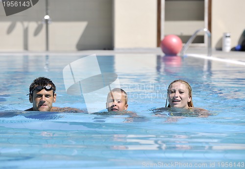 Image of happy young family have fun on swimming pool