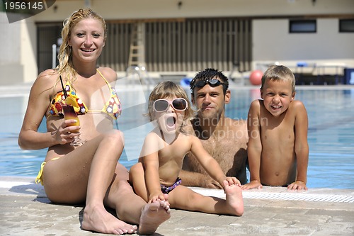 Image of happy young family have fun on swimming pool