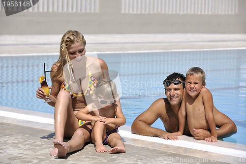 Image of happy young family have fun on swimming pool