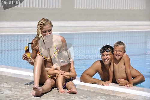 Image of happy young family have fun on swimming pool