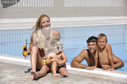 Image of happy young family have fun on swimming pool