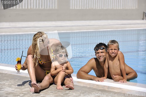 Image of happy young family have fun on swimming pool