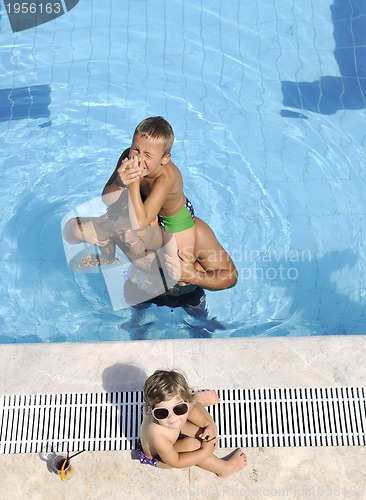 Image of happy young family have fun on swimming pool