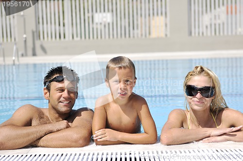 Image of happy young family have fun on swimming pool