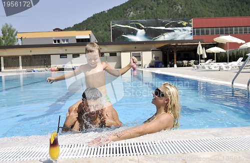 Image of happy young family have fun on swimming pool