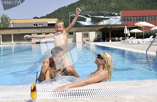 Image of happy young family have fun on swimming pool