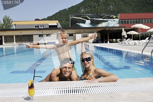 Image of happy young family have fun on swimming pool