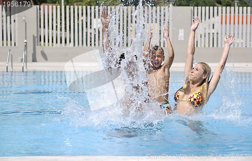 Image of happy young family have fun on swimming pool