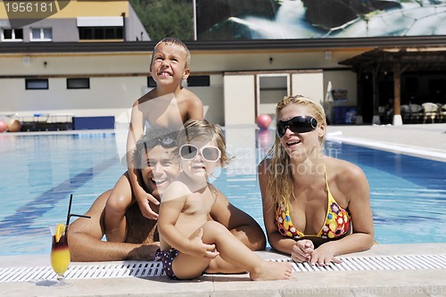 Image of happy young family have fun on swimming pool