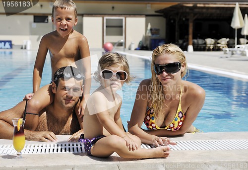Image of happy young family have fun on swimming pool