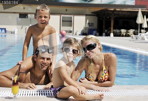 Image of happy young family have fun on swimming pool