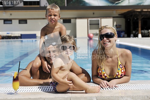 Image of happy young family have fun on swimming pool