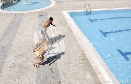 Image of happy young family have fun on swimming pool